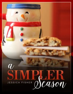 cover image of a simpler season, featuring a snowman mug and a stack of bar cookies.