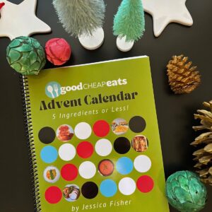 flatlay of printed calendar with christmas decor and ornaments.